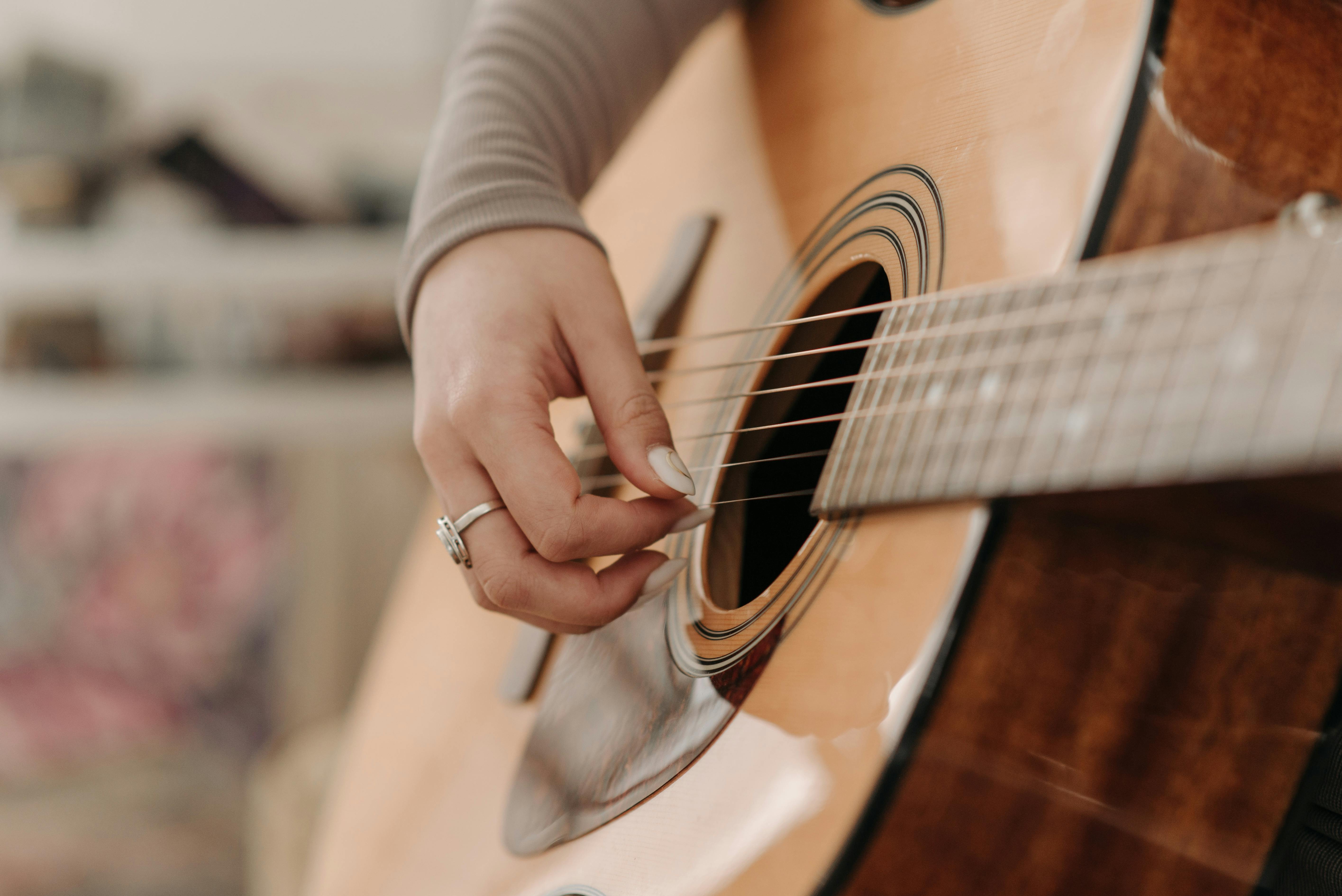 Acoustic guitar with warm, romantic lighting.